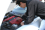 Ron Fellows signing the engine cover of his signature Z06 Corvette
