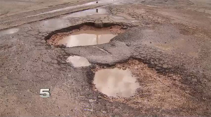 [VIDEO] This Texas-Sized Pothole Caused $800 Damage to a Man's C6 Corvette