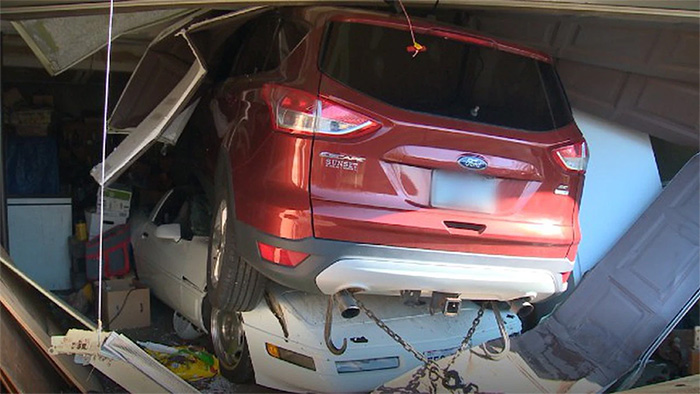 [ACCIDENT] SUV Crashes Into a Garage and Comes to Rest on a C4 Corvette
