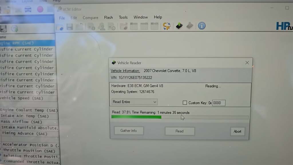The YouTuber working on his laptop with tuning software open.