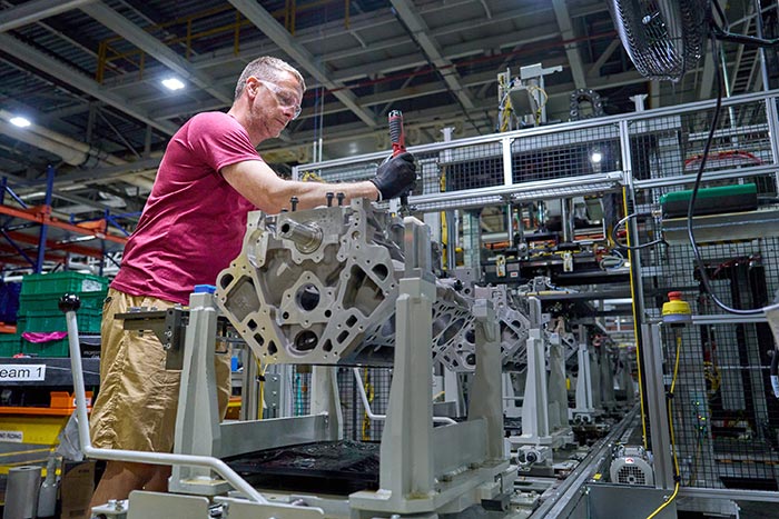A worker at GM’s Flint Engine Operations, where the all-new Gen-6 5.7L and 6.6L V8s are assembled.